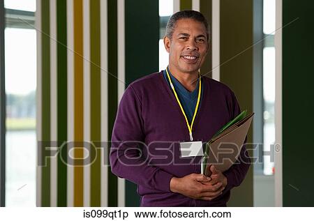 Man holding files, portrait View Large Photo Image Stock Photography - Man holding files, portrait. Fotosearch