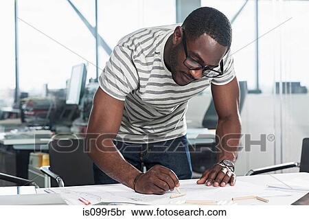 Man planning in office View Large Photo Image Stock Photography - Man planning in office. Fotosearch
