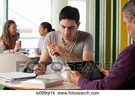 Man using digital tablet, other man making notes View Large Photo Image Stock Image - Man using digital tablet, other man making notes. Fotosearch