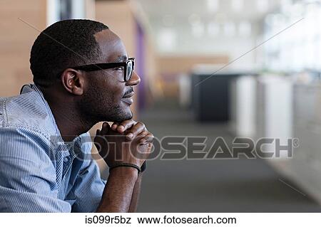 Man with hand on chin, side view View Large Photo Image Stock Photo - Man with hand on chin, side view. Fotosearch