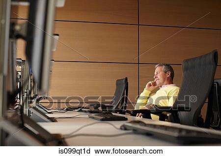Stock Image - Mature student in computer class. Fotosearch
