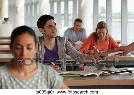 Mature students in class, man receiving book View Large Photo Image Stock Photography - Mature students in class, man receiving book. Fotosearch