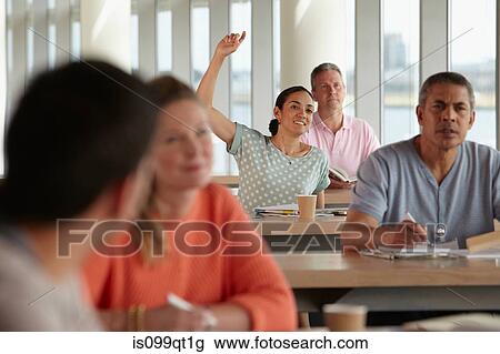 Mature students in class, woman with hand up View Large Photo Image Stock Image - Mature students in class, woman with hand up. Fotosearch