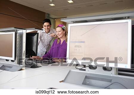 Stock Image - Mature students in computer class. Fotosearch