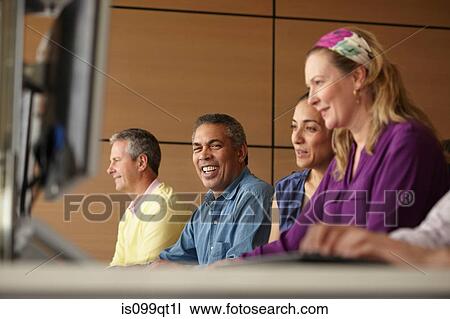 Stock Image - Mature students in computer class. Fotosearch