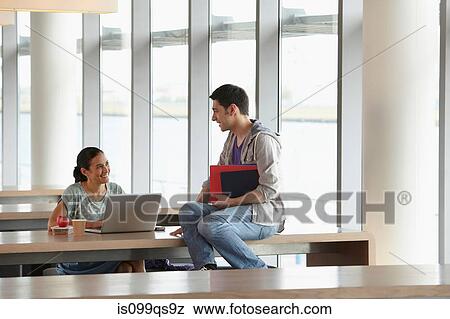 Stock Photo - Mature students talking in classroom. Fotosearch