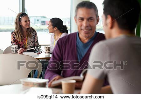 People having conversation in cafe View Large Photo Image Picture - People having conversation in cafe. Fotosearch