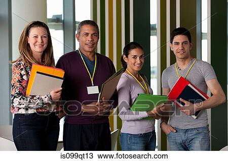Stock Image - People holding files, portrait. Fotosearch