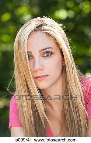 Portrait of a young woman with blonde hair View Large Photo Image Stock Image - Portrait of a young woman with blonde hair. Fotosearch