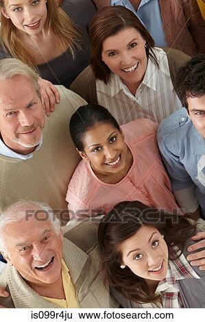 Stock Photograph - Portrait of group of people looking at camera, high angle. Fotosearch