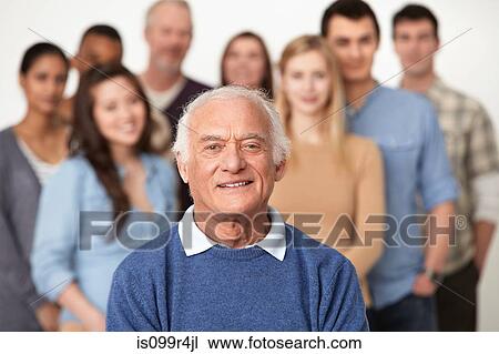 Portrait of man with group of people in background View Large Photo Image Stock Image - Portrait of man with group of people in background. Fotosearch