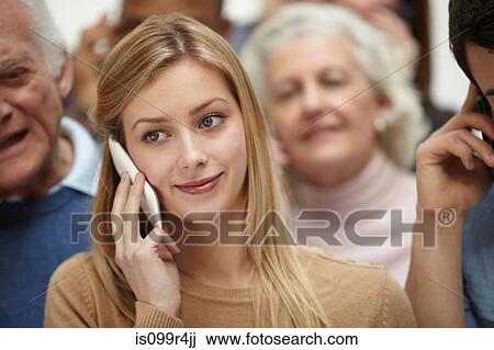 Portrait of woman with group of people in background View Large Photo Image Stock Image - Portrait of woman with group of people in background. Fotosearch