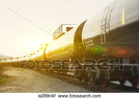 Railroad tanker cars in sunlight View Large Photo Image Stock Image - Railroad tanker cars in sunlight. Fotosearch