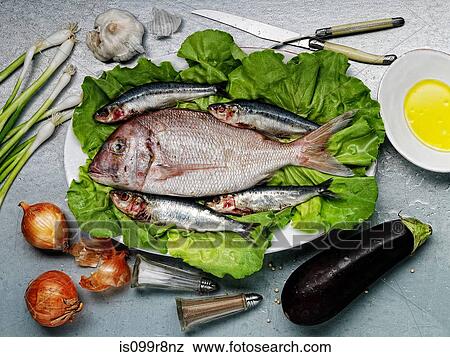 Raw fish and vegetables View Large Photo Image Stock Photo - Raw fish and vegetables. Fotosearch