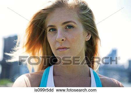 Serious young woman in sunlight View Large Photo Image Stock Image - Serious young woman in sunlight. Fotosearch