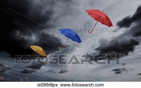 Stock Photo - Three umbrellas floating through cloudy sky. Fotosearch