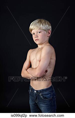 Stock Photography - Topless boy with arms crossed. Fotosearch