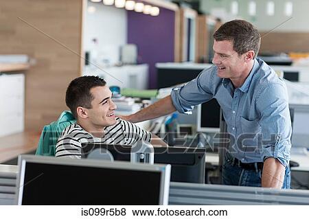 Two colleagues in office View Large Photo Image Stock Photo - Two colleagues in office. Fotosearch