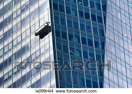Window cleaner scaffold on side of skyscraper View Large Photo Image Picture - Window cleaner scaffold on side of skyscraper. Fotosearch