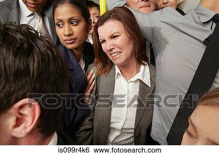 Woman and man with sweaty armpit on crowded subway train View Large Photo Image Stock Photograph - Woman and man with sweaty armpit on crowded subway train. Fotosearch
