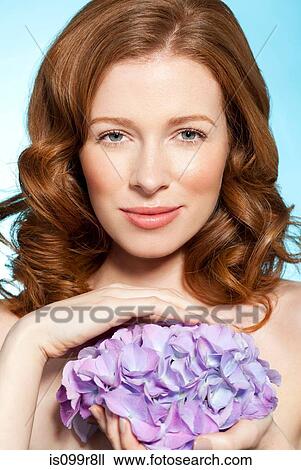 Woman holding purple flowers View Large Photo Image Stock Image - Woman holding purple flowers. Fotosearch