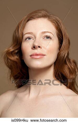 Stock Photograph - Woman looking up. Fotosearch