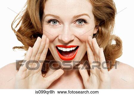 Stock Image - Woman shouting with hands by mouth. Fotosearch