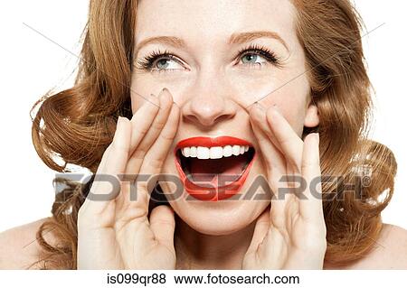 Woman shouting with hands by mouth View Large Photo Image Stock Photo - Woman shouting with hands by mouth. Fotosearch