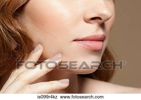Woman touching face, close up View Large Photo Image Stock Photo - Woman touching face, close up. Fotosearch