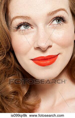 Stock Image - Woman wearing red lipstick. Fotosearch