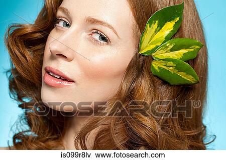 Woman with leaves in hair View Large Photo Image Stock Photo - Woman with leaves in hair. Fotosearch