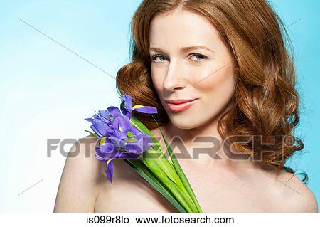 Woman with purple flowers View Large Photo Image Picture - Woman with purple flowers. Fotosearch