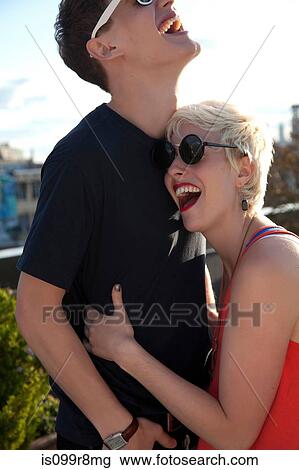 Stock Image - Young couple laughing. Fotosearch