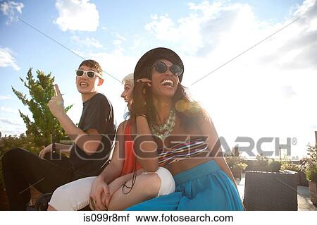 Young friends laughing View Large Photo Image Stock Image - Young friends laughing. Fotosearch