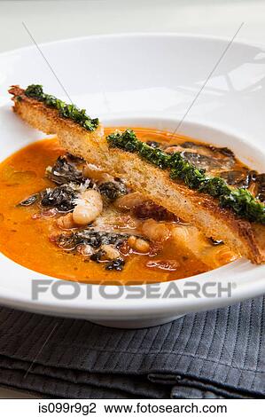 Stock Image - Bean soup with crostini. Fotosearch