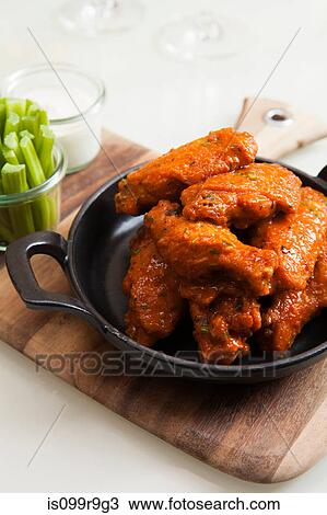 Stock Image - Dish of chicken wings. Fotosearch