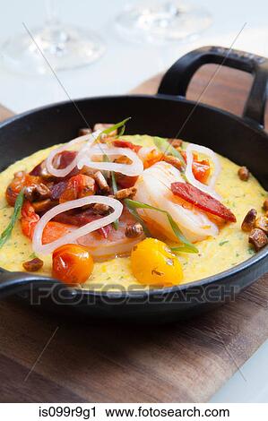 Dish of grits with shrimp in a skillet View Large Photo Image Stock Image - Dish of grits with shrimp in a skillet. Fotosearch