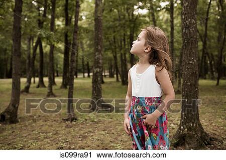 Girl in forest View Large Photo Image Stock Image - Girl in forest. Fotosearch