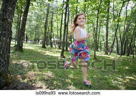 Girl running in forest View Large Photo Image Stock Image - Girl running in forest. Fotosearch