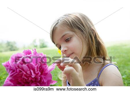 Picture - Girl with pink flower. Fotosearch
