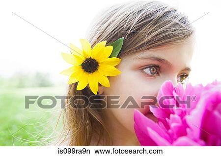 Picture - Girl with pink flower. Fotosearch