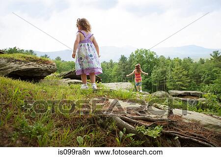 Girls playing on rocks View Large Photo Image Picture - Girls playing on rocks. Fotosearch