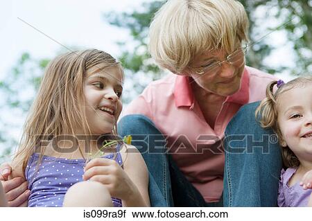 Grandmother with two granddaughters View Large Photo Image Stock Image - Grandmother with two granddaughters. Fotosearch