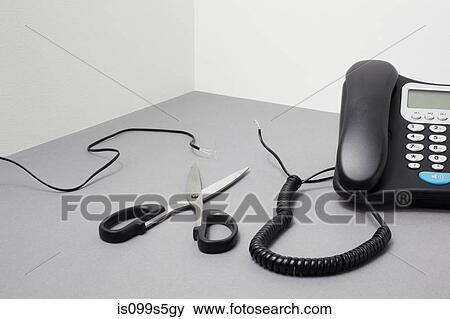 Landline phone, cut cable and scissors View Large Photo Image Stock Photo - Landline phone, cut cable and scissors. Fotosearch