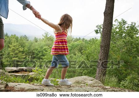 Mother and daughter holding hands View Large Photo Image Picture - Mother and daughter holding hands. Fotosearch