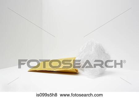 Padded envelope with plastic coming out View Large Photo Image Stock Photo - Padded envelope with plastic coming out. Fotosearch