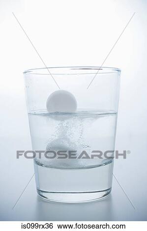Stock Photograph - Pill in glass of water. Fotosearch