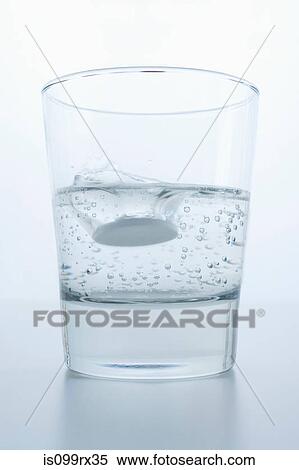 Stock Photography - Pill in glass of water. Fotosearch