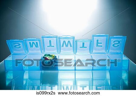 Pills in pillbox View Large Photo Image Stock Photograph - Pills in pillbox. Fotosearch