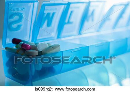 Stock Photograph - Pills in pillbox. Fotosearch